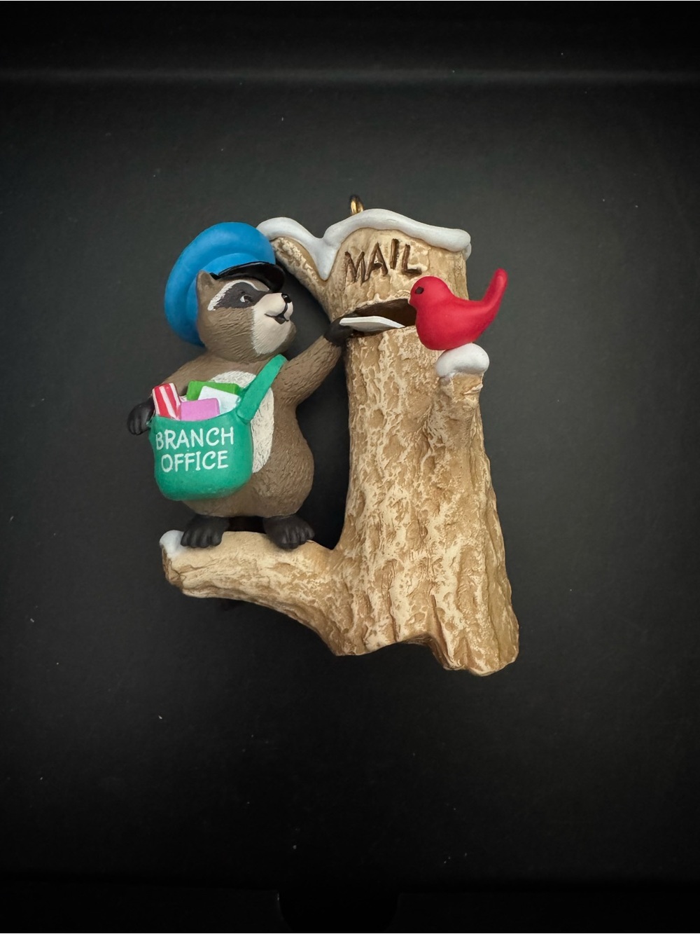 Hallmark Raccoon Mail Carrier Ornament with Blue Hat and Green Bag